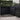 Screen With Envy black composite fence panels with Moucharabiya privacy screens in a garden corner setting.